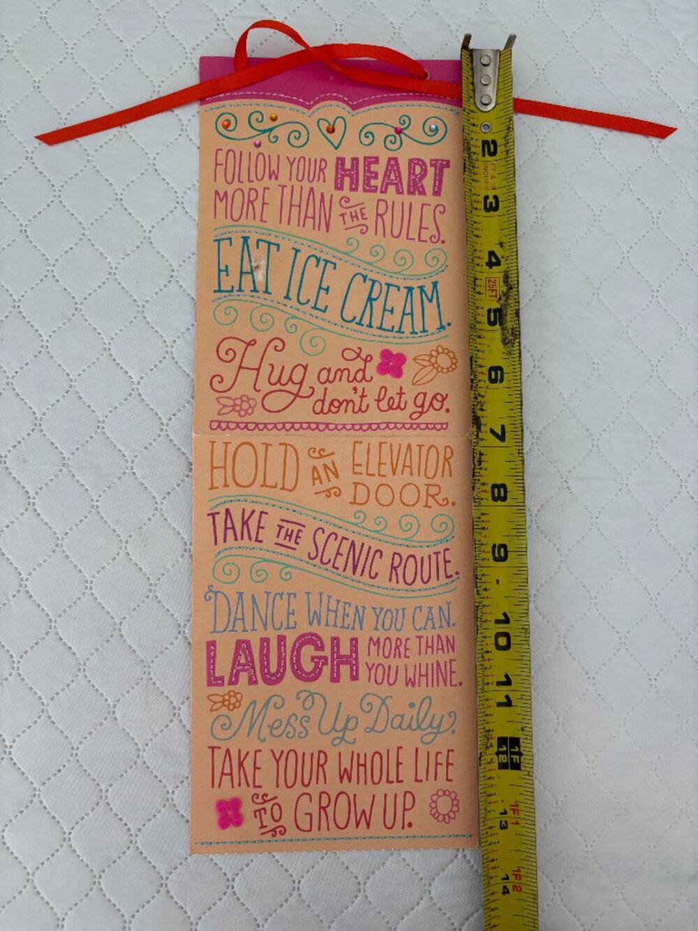 Decorative paper sign with various life advice and whimsical suggestions
